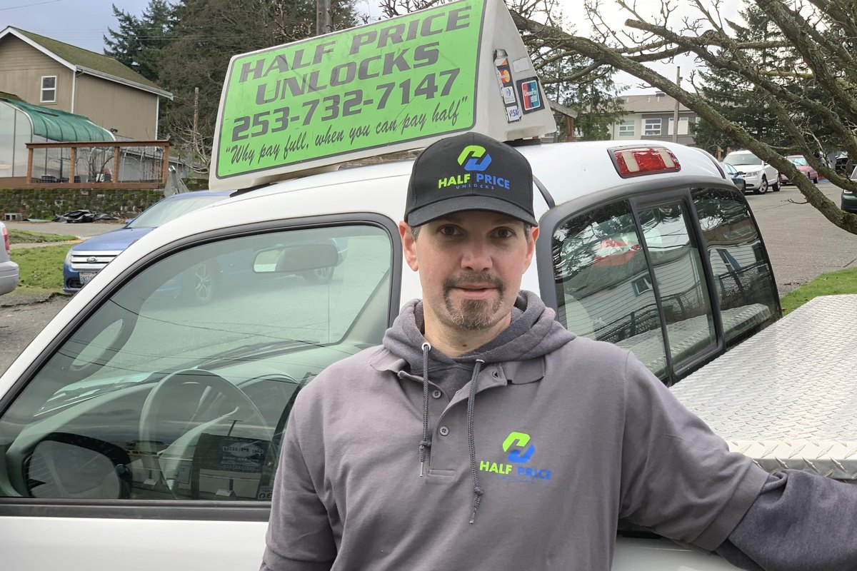 Half Price Unlocks technician and truck sign
