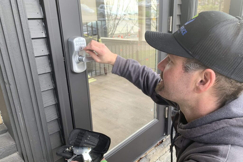 Half Price Unlocks locksmith servicing a commercial door lock